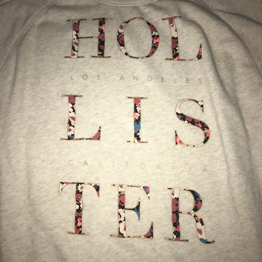 Hollister sweater with floral lettering size xs